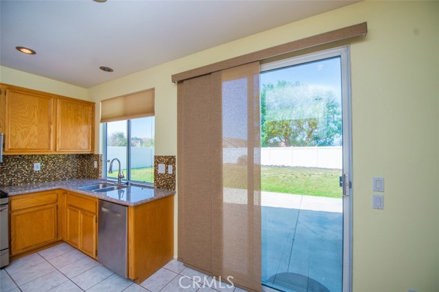 Sliding glass door open to big  backyard