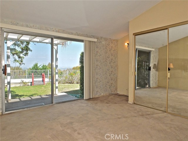 West lower bedroom overlooking the rear yard and views beyond.