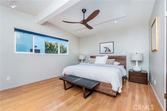 Spacious master bedroom with his and hers closets with custom built-in organization.