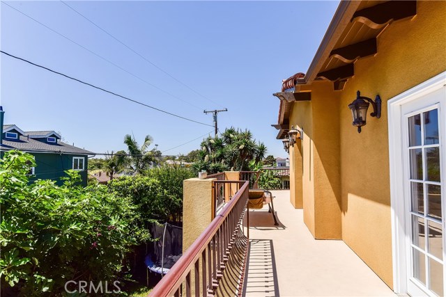 Three bedrooms all have access to this west facing balcony running the entire width of the home, sitting up high just inviting in cool breezes