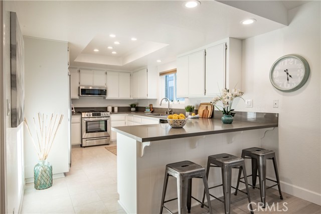 Stunning new quartz counters in kitchen.