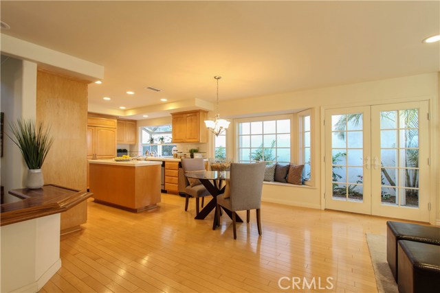 Breakfast sitting area off of Kitchen and Family opening through French Doors to patio.