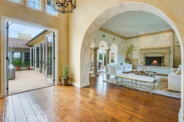 Some of the many French doors in this home leading to the interior patio, and also the living room with fireplace.