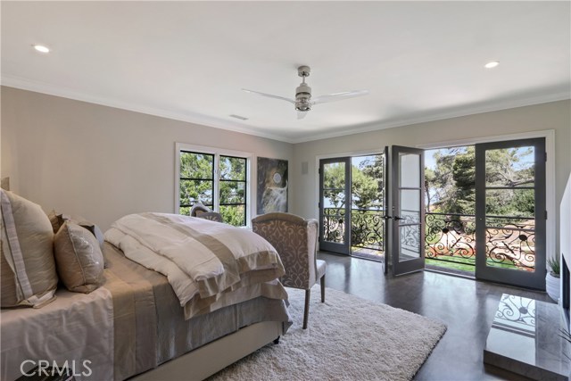 Elegant master bedroom with refreshing views. Note: the fireplace in this bedroom is decorative only