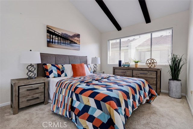 Both additional bedrooms are roomy and include vaulted and beamed ceilings!