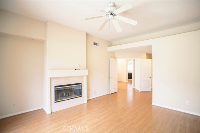 Double doors open to this master suite with a fireplace and vaulted ceiling