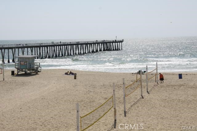 beach, pier and volleyball across the way