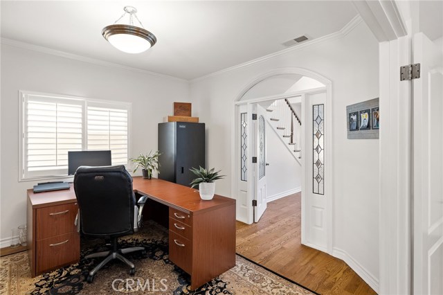 View of office through second entryway from the living room. View of office through second entryway from the living room.
