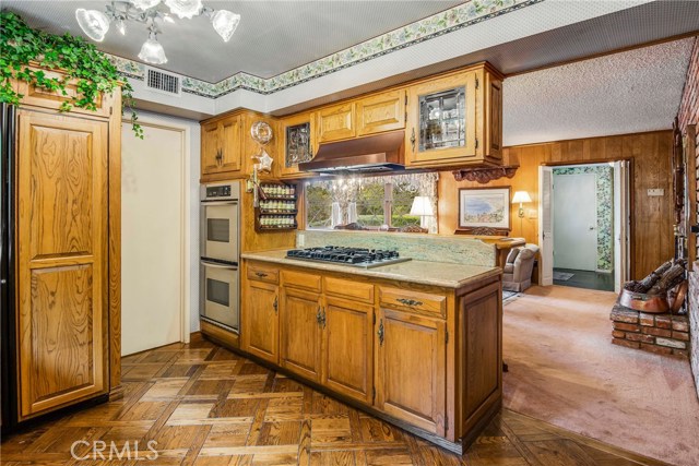 Gas stovetop, double oven and built-in refrigerator