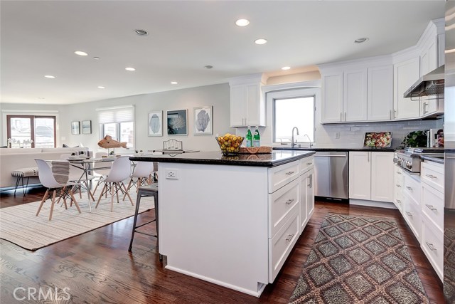 Kitchen island with plenty of storage and breakfast bar make this kitchen stand out from the rest.