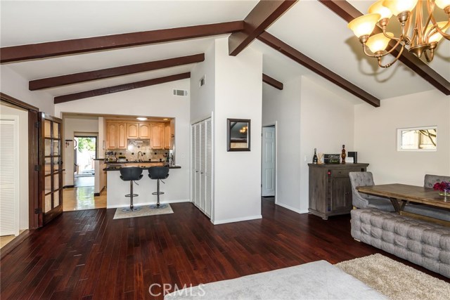 Looking from the living room to kitchen and front door