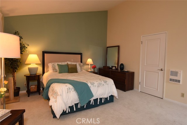 Another view of the master bedroom.  Door leads to the walk-in closet (don't miss the raised closet storage area behind another door in the master closet)