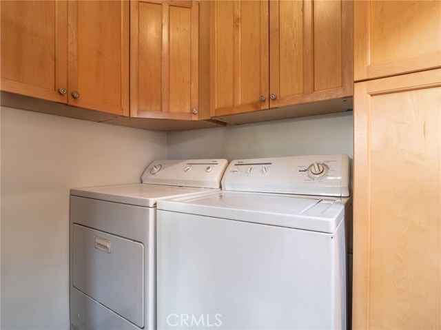 Laundry conveniently located in corner at end of the kitchen, tons of storage too!