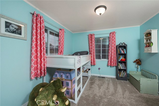 Second bedroom with plush carpeting