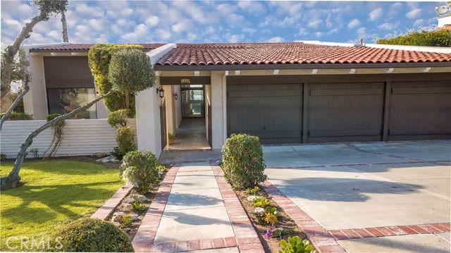 Front entry gate and 3 car garage in beautiful upper Lunada Bay.