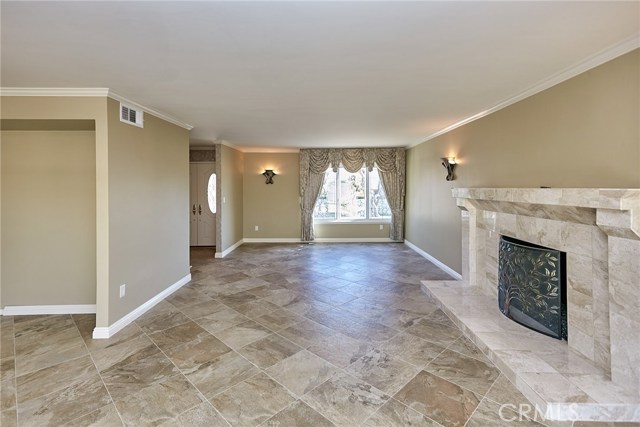 Dining area connected to formal living room with fireplace