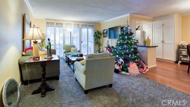 Large Living Room with lots of natural light or close the plantation shutters. Sliding glass door with access to Balcony