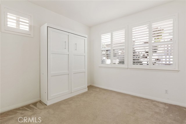 Downstairs bedroom, complete with a murphy bed! Because once your guests fall in love with the neighborhood, they *will* be staying a while. (Even with the murphy bed down there is room for furniture/toys/a Peloton ;)