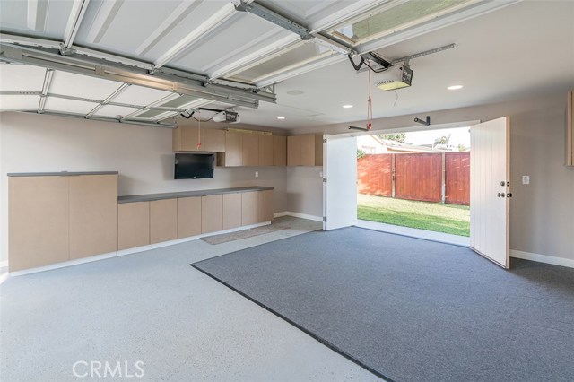 2 car garage with doors leading to back yard.