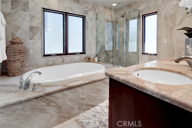 Lots of natural light makes this ensuite master bathroom a relaxing and calming space.