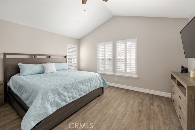 primary bedroom with beamed ceilings and ceiling fan primary bedroom with beamed ceilings and ceiling fan