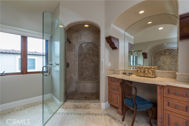 Another Master bathroom view, with beautiful shower with seating and large make-up vanity area.