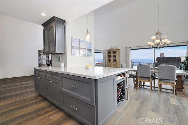 Another view of the kitchen , the dining area and the ocean view