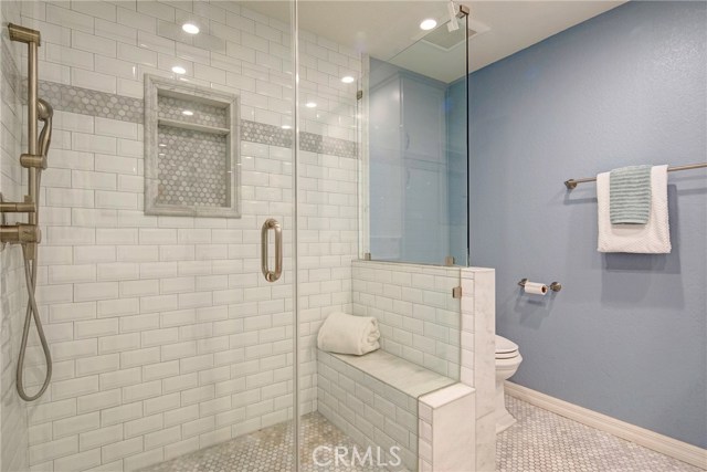 En-suite master bath with carrera marble countertops, dual sinks, tons of cabinet space, huge walk-in shower with beveled subway tile, dual shower heads including rain shower. En-suite master bath with carrera marble countertops, dual sinks, tons of cabinet space, huge walk-in shower with beveled subway tile, dual shower heads including rain shower.