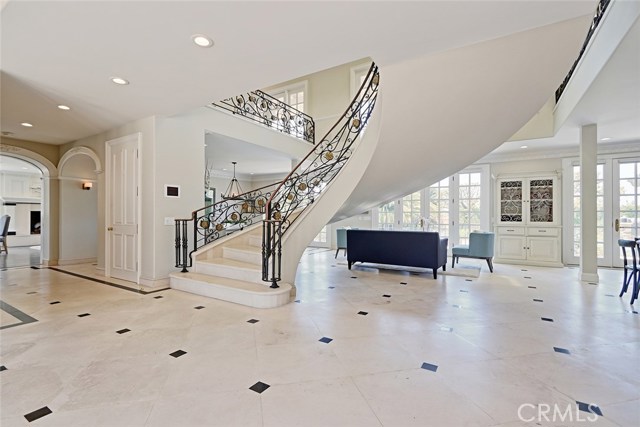 An open concept floorplan, lined with the wall-to-wall French Doors.