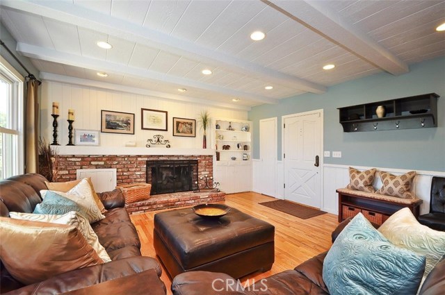 Charming Living Room with Fireplace and Cabinetry from 1927! Combining the best of the old with the new.