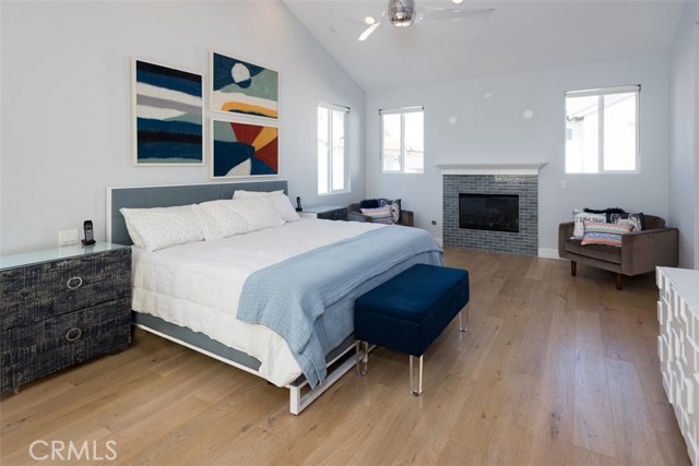 Large master retreat has fireplace and balcony.