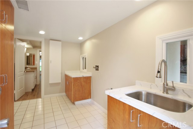 large laundry room with wash sink