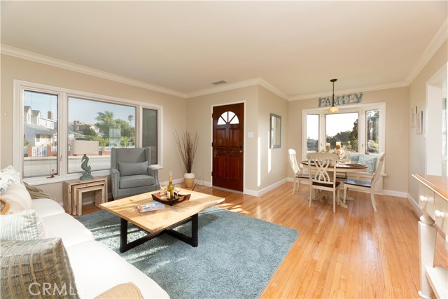 Living room open to the bay window, dining area