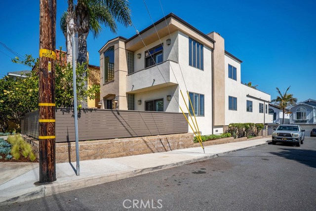 Running street to alley this home takes every advantage of curb appeal, sunlight, and access.