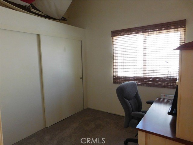 an upstairs bedroom being used as a office