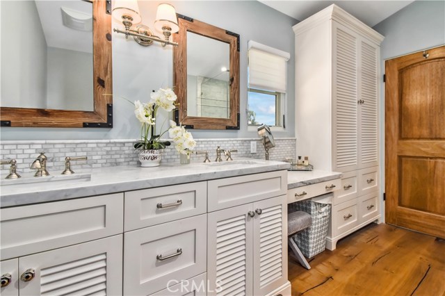 Master Bathroom with Calcutta Marble and Custom Cabinetry