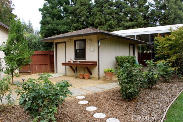 Work and potting shop with storage shed combo