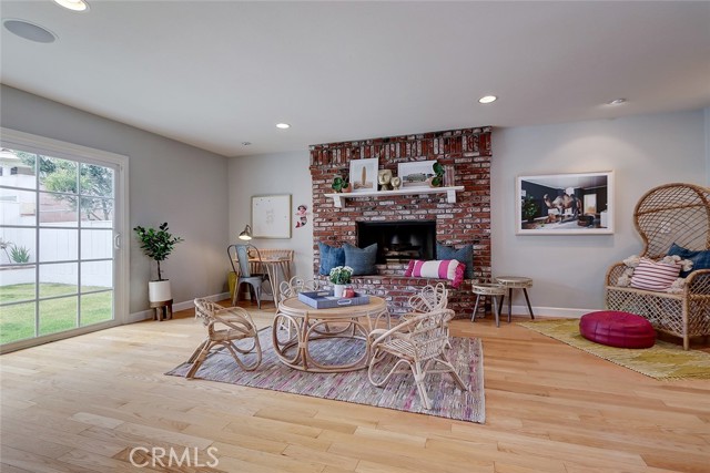 A brick fireplace is the focal point of the family room.