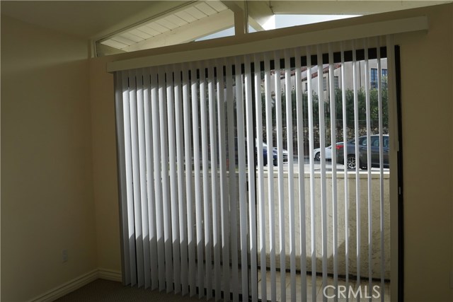 Middle bedroom #2 with sliding glass doors to balcony.