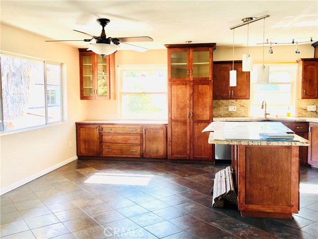 Spacious eating area and kitchen island. so much natural light.