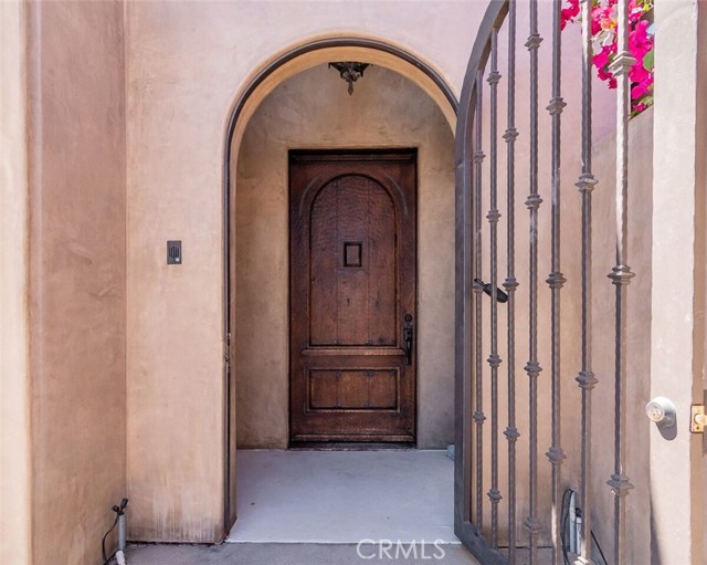 Arched and gated front entry
