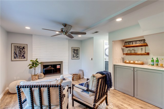 Connected to the kitchen is separate family room with a fireplace, and laundry station with w/d cabinets