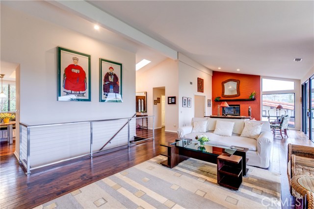 The living room leads to the dining room and kitchen