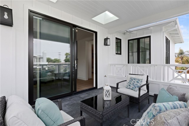 The immaculately finished,covered balcony off the Master bedroom even has skylights