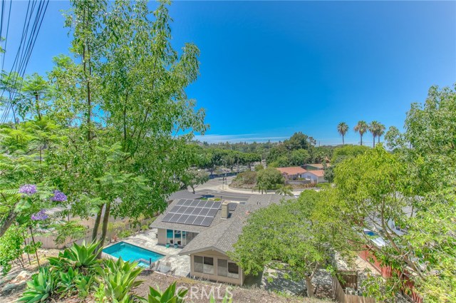 Neighborhood and city views from the tranquil retreat at the upper-most level of the backyard