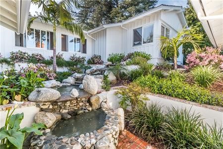 Natural waterfall within the center courtyard. Provides soothing sounds and lush landscaping. Accessible from master bedroom.