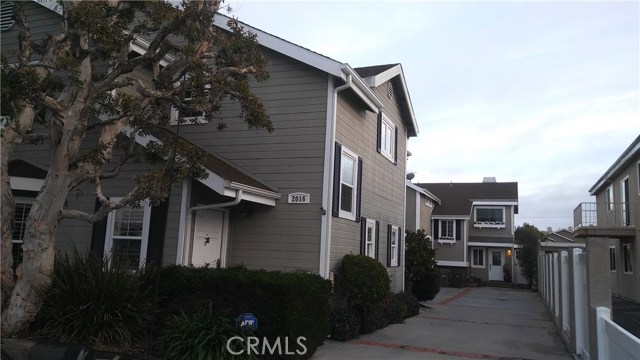 Long driveway allows for additional off-street parking, though shared with the front unit.
