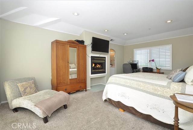 Spacious master suite with double sided fireplace and walk-in closet