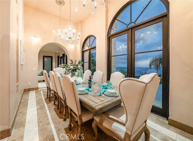 Imagine your formal dinner party with stunning ocean views and mesmerizing sunsets. Formal dining room is conveniently adjacent to cocktail lounge and temperature controlled wine room.