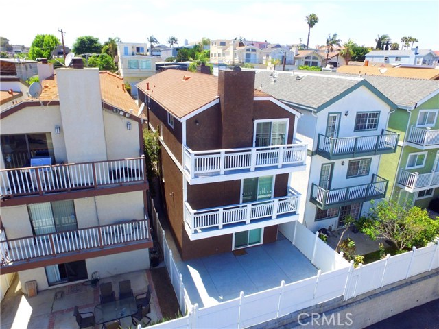 Aerial view of rear patio, master bedroom and living room balconies.